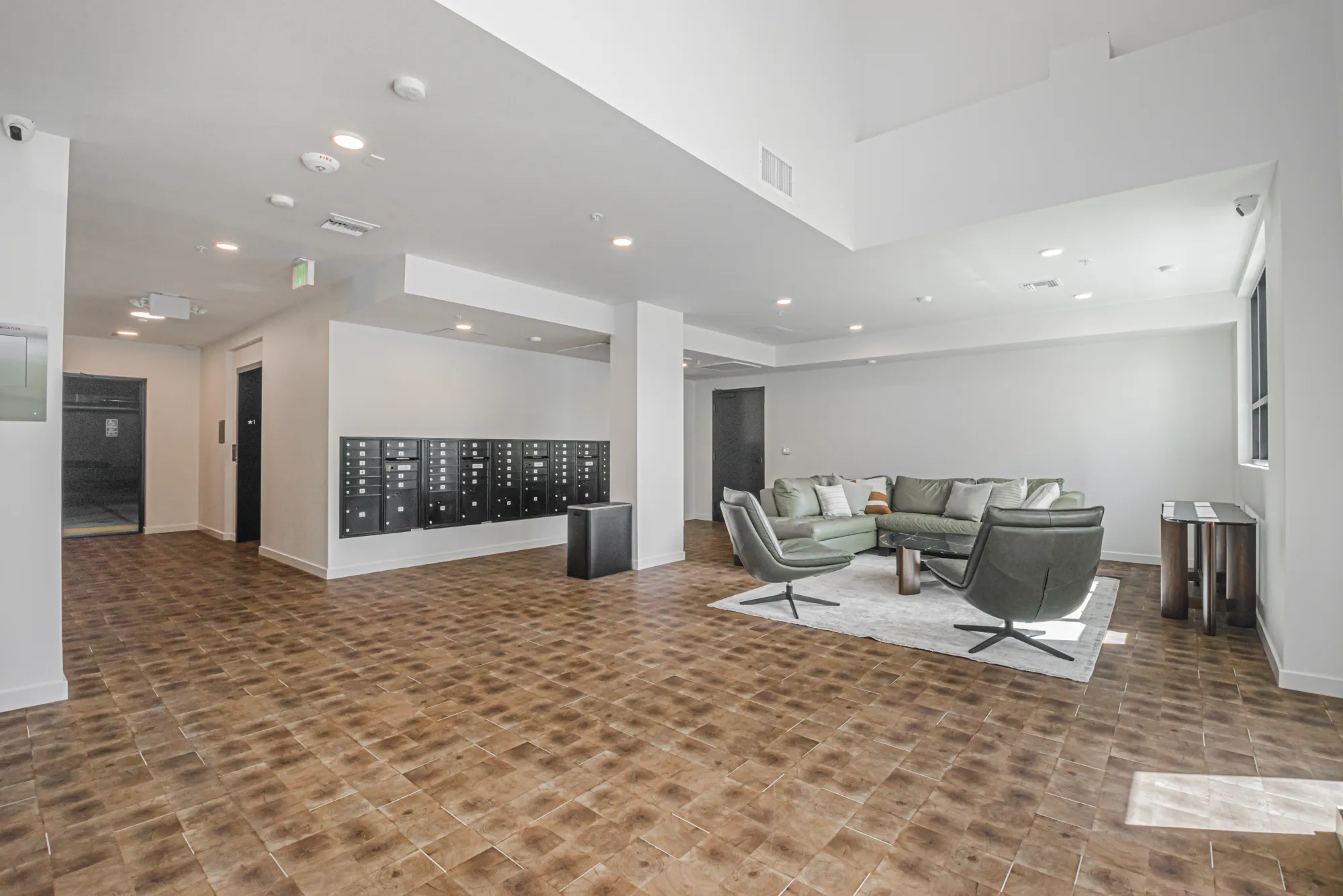 The Gramercy residential lobby with mailboxes and lounge seating