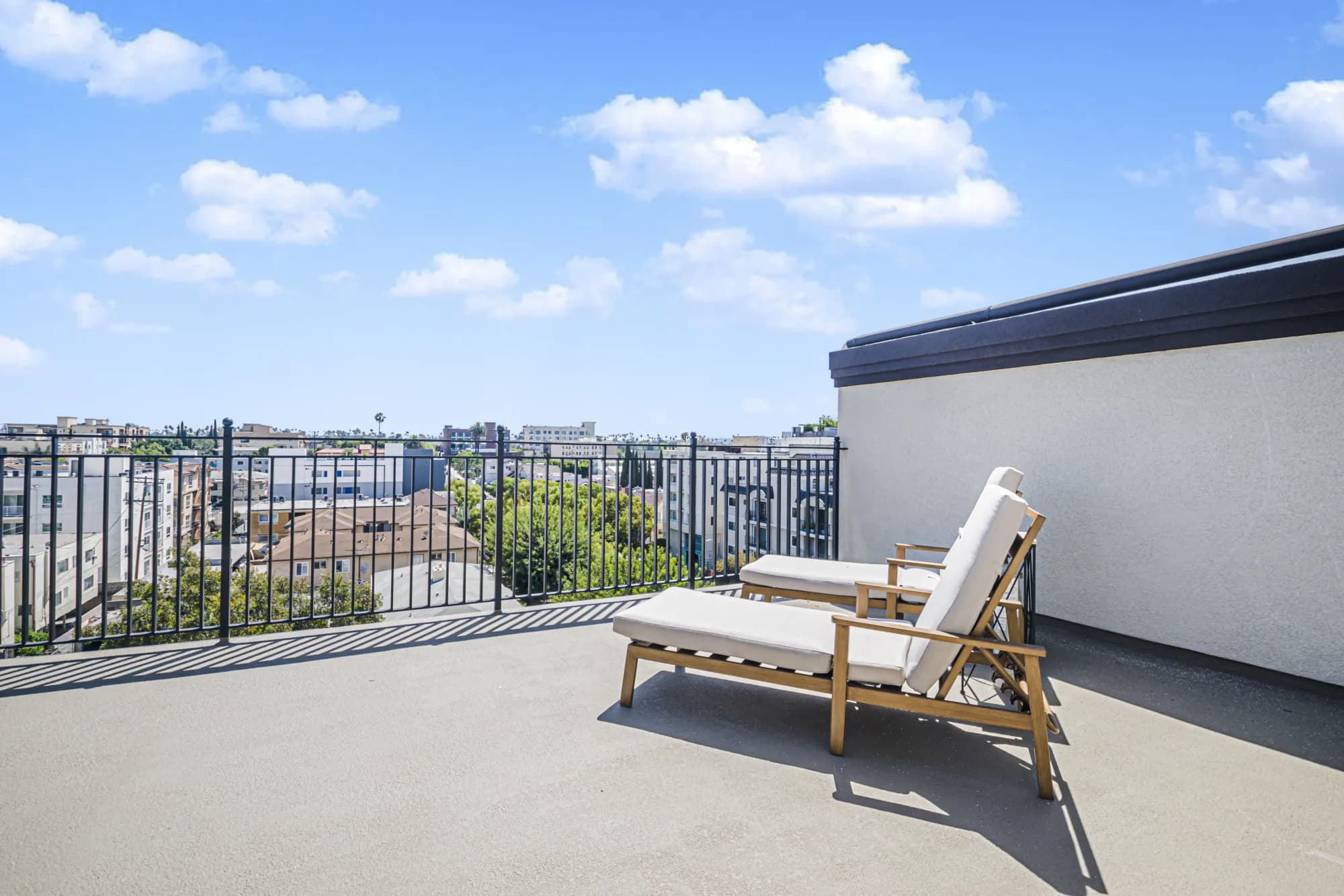 Rooftop sun deck with lounge chairs at The Gramercy