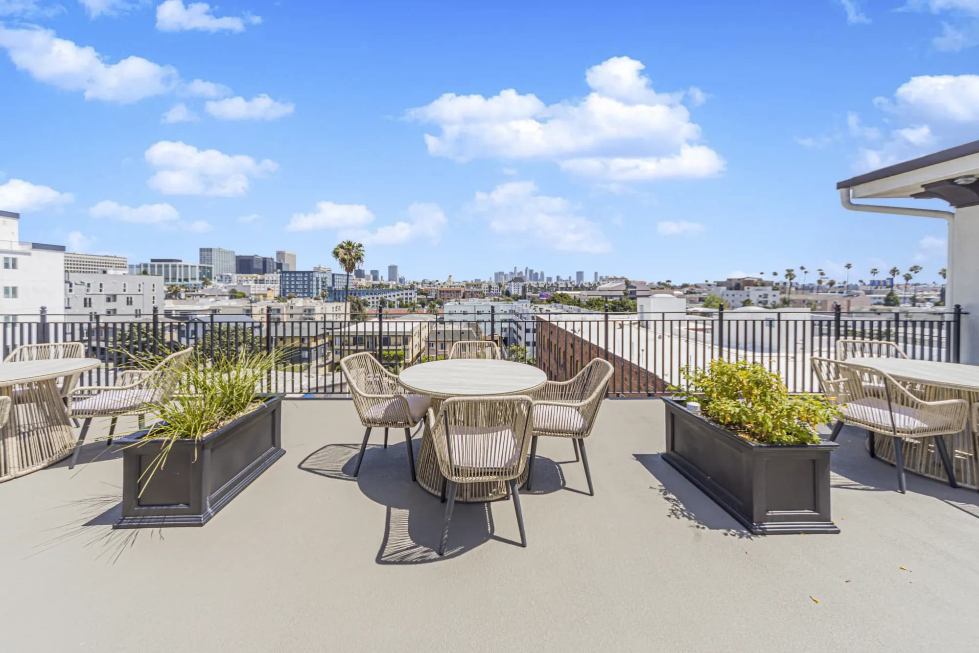 Rooftop terrace with dining tables at The Gramercy